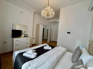 Postel nebo postele na pokoji v ubytování Santa Villa Hotel
