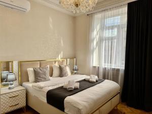 Postel nebo postele na pokoji v ubytování Santa Villa Hotel