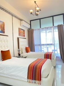 Un pat sau paturi într-o cameră la Red Angel Hotel by Our story +33 fotografii