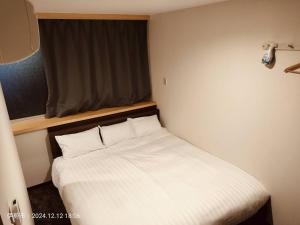 Ліжко або ліжка в номері FLYCAT INN 伊勢