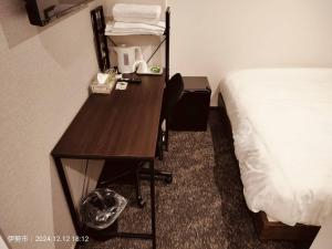 Ліжко або ліжка в номері FLYCAT INN 伊勢