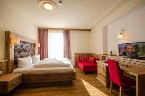 TV a/nebo společenská místnost v ubytování Hotel Gasthof Jägerhaus