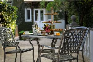 an outdoor table with a tray of food on it at Le Manoir Boutique Estate in Johannesburg