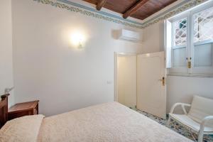 Postel nebo postele na pokoji v ubytování Amalfi un po’...