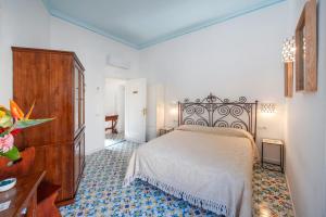 Postel nebo postele na pokoji v ubytování Amalfi un po’...