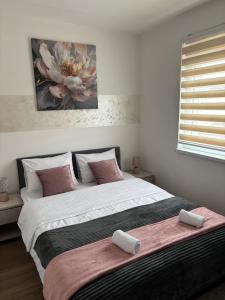 Una cama o camas en una habitación de Apartman Milan