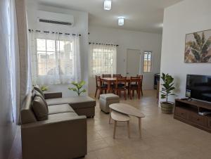 a living room with a couch and a table at Balay Hermosa in Dauis