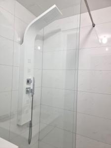 a shower with a glass door in a bathroom at Start appart in Village-Neuf
