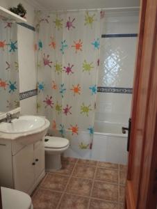 a bathroom with a sink and a toilet and a shower at Torrevieja Centro in Torrevieja