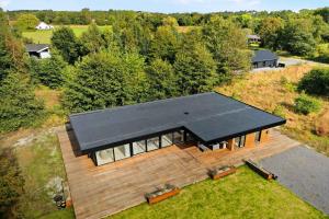 an overhead view of a house with a black roof at Holiday Home On Bornholm Close To Sea And Beach in Vester Sømarken