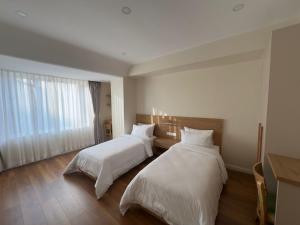 Tempat tidur dalam kamar di Hotel snowlion