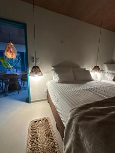 Postel nebo postele na pokoji v ubytování Maison Plage Atins