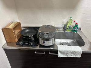 Kuchyň nebo kuchyňský kout v ubytování 高島市一棟貸切可能貸別荘グループファミリーok 大人数でご利用だとお得連泊がお得BBQ可能自転車無料利用可ペット可 駅徒歩10分