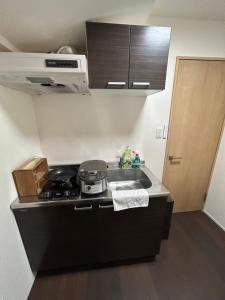 Kuhinja oz. manjša kuhinja v nastanitvi 高島市一棟貸切可能貸別荘グループファミリーok 大人数でご利用だとお得連泊がお得BBQ可能自転車無料利用可ペット可 駅徒歩10分