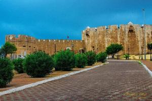 a large building with a brick road in front of it at Apartment in Safi quartier saida 2 in Safi