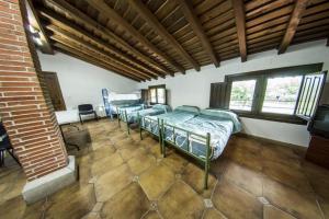 Ένα ή περισσότερα κρεβάτια σε δωμάτιο στο Hotel Rural La Majada