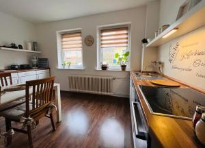 a kitchen with a sink and a counter top at Casa Cara in Liebenburg