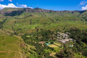 an aerial view of a village in the mountains at Cavern Resort & Spa in Bergville