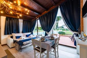 a bedroom with a bed and a table and chairs at Sweet Dreams in Peschiera del Garda +44 photos