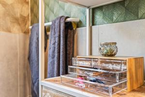 a dresser in a bathroom with a mirror at Green Suite - Whirlpool Garden - free parking - WiFi in Vienna +31 photos
