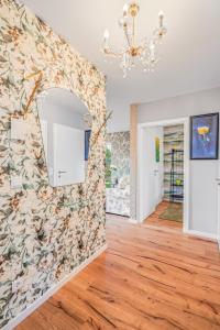 a living room with a wall mural of fish at Green Suite - Whirlpool Garden - free parking - WiFi in Vienna