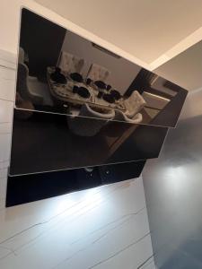 a shelf in a kitchen with some shoes on it at Victoria Happy Hub in Mombasa