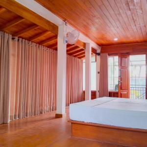 Postel nebo postele na pokoji v ubytování Thusara Guesthouse