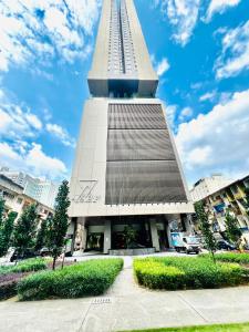 a large building with a tall tower at AXON RESIDENCE BUKIT BINTANG KL CITY View in Kuala Lumpur
