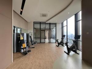 a gym with treadmills and exercise equipment in a building at AXON RESIDENCE BUKIT BINTANG KL CITY View in Kuala Lumpur