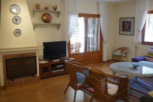 A television and/or entertainment centre at Casa la Paloma