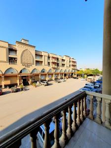a balcony of a building with a parking lot at The Signature Studio's in Rawalpindi