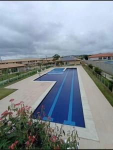 a large swimming pool with blue paint on it at Vog caruaru in Caruaru