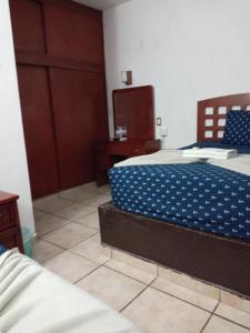 Postel nebo postele na pokoji v ubytování Hotel Colonos Los Cabos