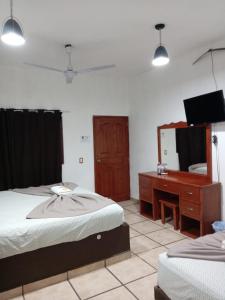 Postel nebo postele na pokoji v ubytování Hotel Colonos Los Cabos