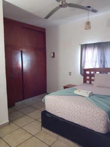 Postel nebo postele na pokoji v ubytování Hotel Colonos Los Cabos
