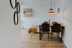 a dining room with a table and chairs at Moderne Wohnung in Dernbach WW in Dernbach