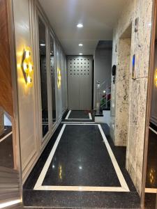a hallway of a building with a walkway at HOTEL PREMIER CHOICE - JUST 50 Meters FROM AJMER SHARIF DARGAH in Ajmer