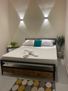 a bedroom with a bed with two towels on it at Tota house in dahab in Dahab