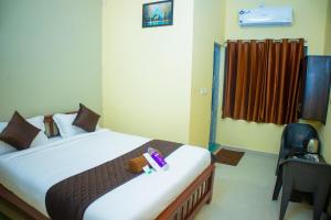 Postel nebo postele na pokoji v ubytování sky suite residency