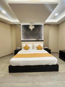 a bedroom with a large bed in a room at Hotel The Grand Agastya in Kaohni +15 photos