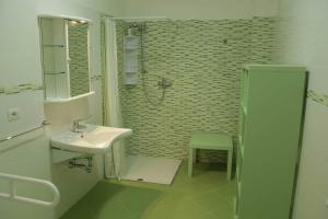 a bathroom with a sink and a shower at Monolocale Santa Caterina in Santa Caterina di Nardò +58 photos