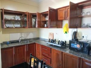 Η κουζίνα ή μικρή κουζίνα στο Usalama Apartment +20 φωτογραφίες