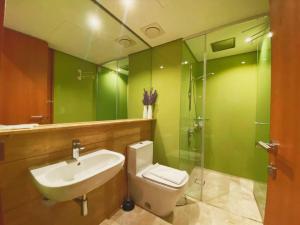 a bathroom with a sink and a toilet and a shower at Apartment Sky by MonoSuites KLCC in Kuala Lumpur +20 photos