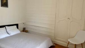 Postel nebo postele na pokoji v ubytování Au coeur d'Autun + 4 fotografie