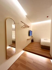 Postel nebo postele na pokoji v ubytování ONE18 Boutique Hotel