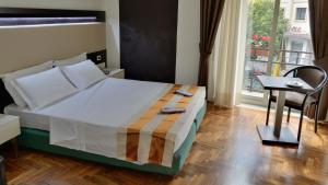 Postel nebo postele na pokoji v ubytování Grande Albergo Maugeri