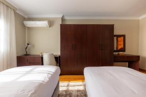 Postel nebo postele na pokoji v ubytování 1842 - 2br Serviced Apartment - Central