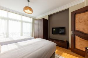 Postel nebo postele na pokoji v ubytování 1842 - 2br Serviced Apartment - Central