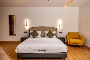 Postel nebo postele na pokoji v ubytování Ritz Hotel Juba