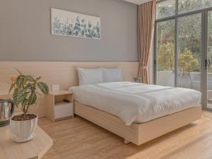 Krevet ili kreveti u jedinici u okviru objekta Lux Nest hotel